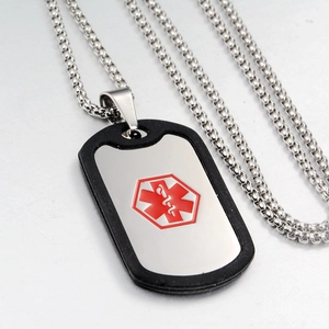 Detail of medical alert ID tag necklace with red Star of Life and black silicone silencer