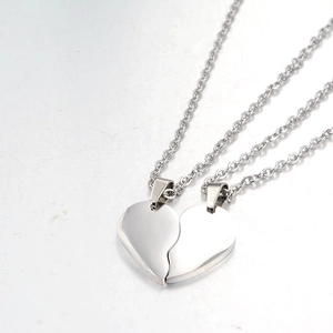 Detail of magnetic heart pendant necklaces with silver polished mirror finish and O-chain