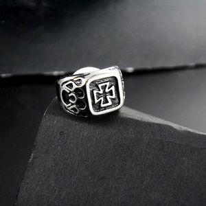 Retro punk gothic titanium steel biker ring with black iron cross on a stone base