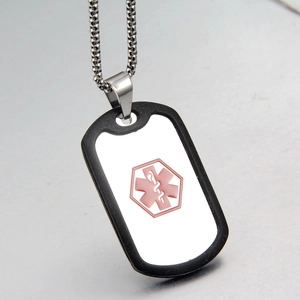 Detailed macro view of silver medical alert necklace with pink Star of Life icon