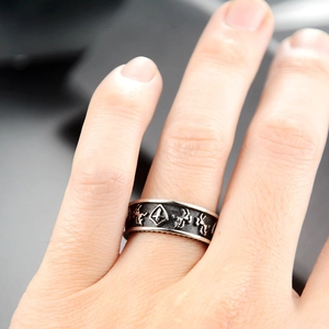 Detailed macro view of punk style shield and stallion motifs on a titanium steel ring