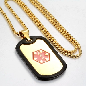 Detail view of medical alert dog tag necklace with golden box chain and Star of Life symbol