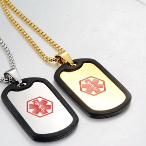 Detail of medical alert dog tag pendants with red Star of Life and black silencers