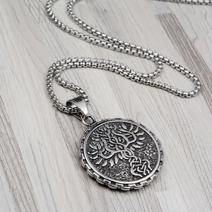 Vintage Tree of Life pendant necklace in silver-colored stainless steel with relief detail