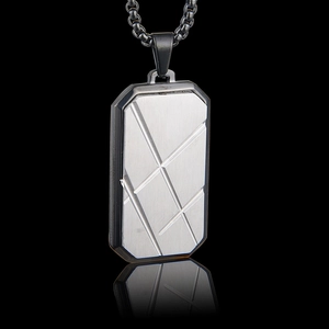 Detail shot of rectangular dog tag pendant with brushed silver texture and black frame
