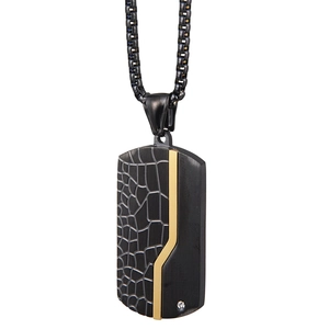 Detail of black stainless steel dog tag necklace with cracked texture and gold Z inlay