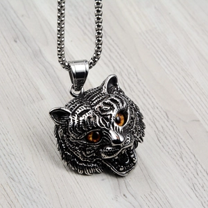 Retro hip-hop tiger head pendant necklace in vintage silver with orange gemstone eyes