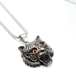 Vintage hip hop tiger head pendant necklace in antique metal finish with amber eyes
