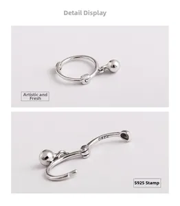 Macro detail of S925 sterling silver ball drop earrings showing the official hallmark stamp