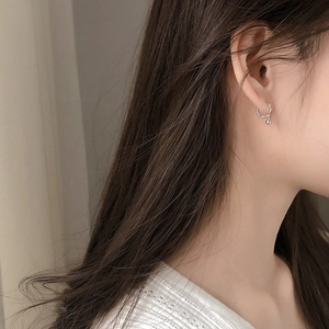 Minimalist silver hoop earrings with a small polished metal bead for small earlobes