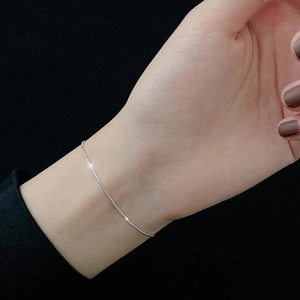 Elegant minimalist S925 sterling silver snake chain bracelet shown on a female wrist
