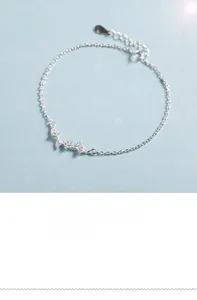 Detailed view of silver ginkgo leaf bracelet with delicate textures and extension chain