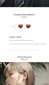 Close-up of small 5x5mm red heart S925 silver stud earrings shown on model ear