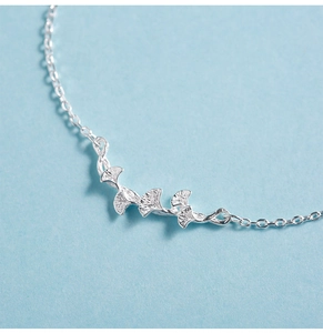 Macro shot of s925 silver ginkgo leaf bracelet with textured matte finish details