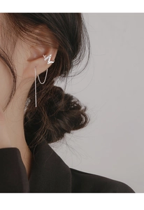 Detail of silver lightning ear cuff and threader earring set with cubic zirconia stones