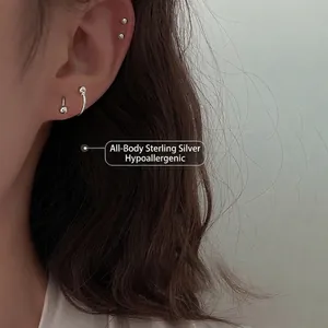 Minimalist S925 sterling silver spiral stud earrings set shown on ear model