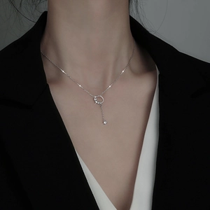 Elegant silver circle tassel necklace for women featuring a minimalist ring and star pendant