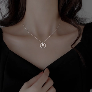 Minimalist silver circle and pearl necklace elegant choker style for women on black outfit