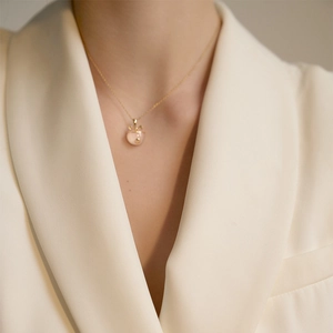 S925 sterling silver necklace with pink chalcedony cat pendant worn on model