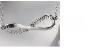 Detailed close-up of S925 silver infinity pendant with micro-set sparkling cubic zirconia