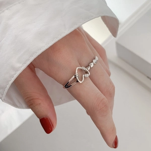 Retro hollow heart open silver ring with twisted rope texture for women in a side view