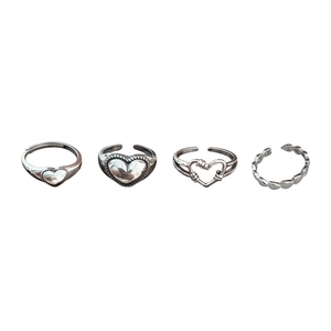Set of four vintage silver heart-shaped adjustable open rings for women with polished finish