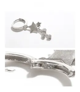 Détail de boucles d'oreilles étoile en argent S925 avec pampilles et micro-cristaux