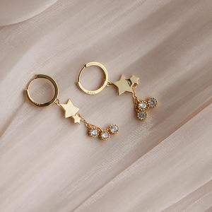 Élégantes boucles d'oreilles étoile en argent S925 doré avec pampilles en zircone