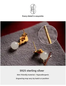 Macro detail of S925 sterling silver stamp on vintage gold-plated Hetian jade earrings