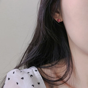 Minimalist S925 sterling silver heart-shaped red zircon stud earrings worn on female ear