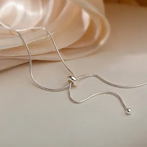 Elegant adjustable silver snake chain necklace with slider bead and sphere pendants