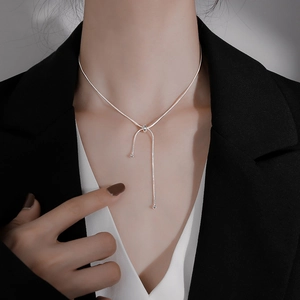 Minimalist silver snake bone chain necklace with adjustable asymmetric drop and polished beads