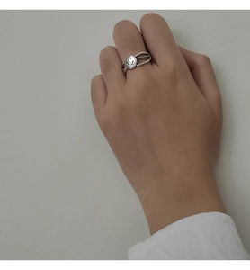 Macro detail of S925 sterling silver double layer smile ring with Love Me engraving
