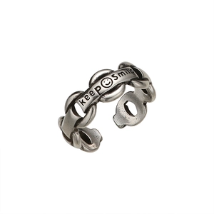 Vintage chain ring in retro silver finish featuring a keep smile engraving and open design