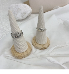 Retro S925 silver rings with smiling face and Good Luck engravings on display