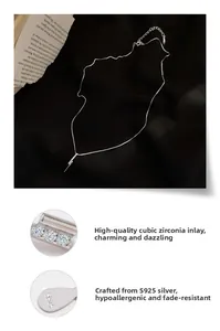 Detail of S925 silver necklace with micro-paved cubic zirconia on a vertical bar pendant