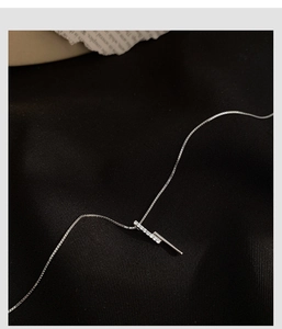 Detail of s925 silver necklace featuring vertical bar pendants with micro-pave zircons