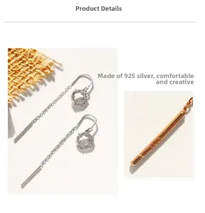 Détail macro du poinçon S925 sur la boucle d'oreille en argent avec chaîne