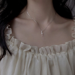 Minimalist S925 silver necklace with micro-paved vertical bar pendant on model