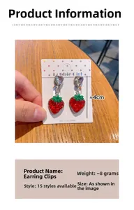 Detail of red glitter strawberry clip-on earrings with heart crystal for girls