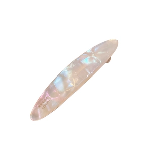 Elegant acetate spring hair clip with mother-of-pearl texture in blue and pink hues