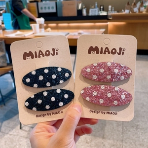 Fermagli per capelli glitter per bambine con pois neri e rosa in forma ovale