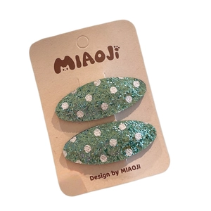 Set di due fermagli per capelli verdi glitterati con pois bianchi per ragazze e donne