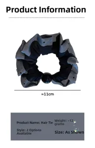 Detailed view of 11cm gray polka dot elastic hair tie with central black bead decoration