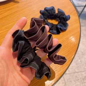 Handmade polka dot pleated scrunchies with white contrast stitching in black and brown