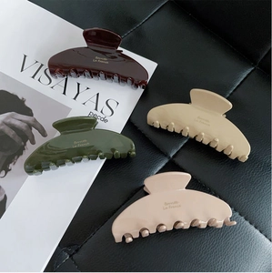 Glossy acetate shark hair claws in Morandi colors with elegant gold Barrette La France logo