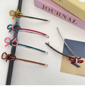 Set of five elegant minimalist metal hair clips with colorful woven bow decorations