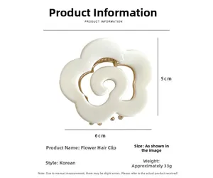 Detail view of cream flower claw clip showing 6cm by 5cm dimensions and resin texture