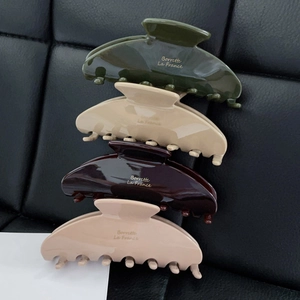 Morandi colors acetate hair claws set in dark green, beige, brown, and pink with gold label