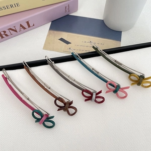 Set of 5 vintage colorful bow hair clips with metal base on aesthetic background